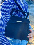 Sac noir avec poignée rigide